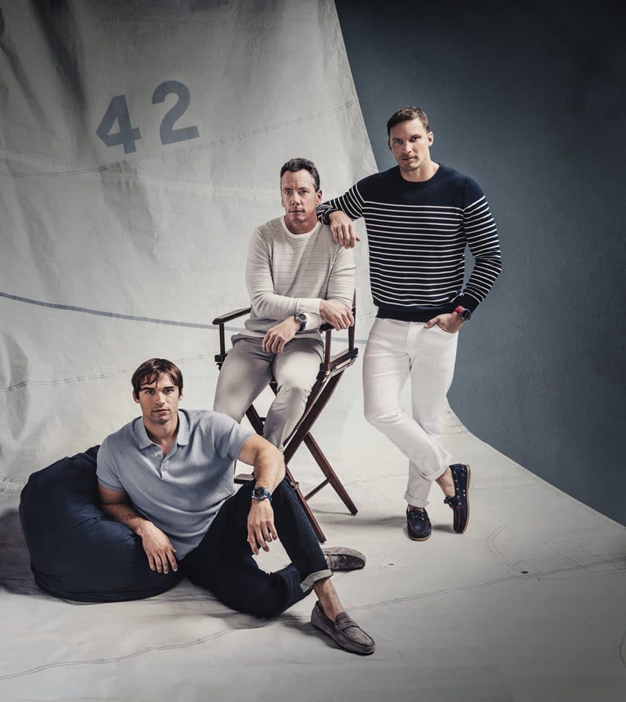 Tre menn som bærer Garmin Marq-klokker